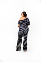 Black and White stripe one off shoulder jumpsuit, relaxed fit with 3/4 length sleeves, self waist tie belt, side pockets, and wide legs.